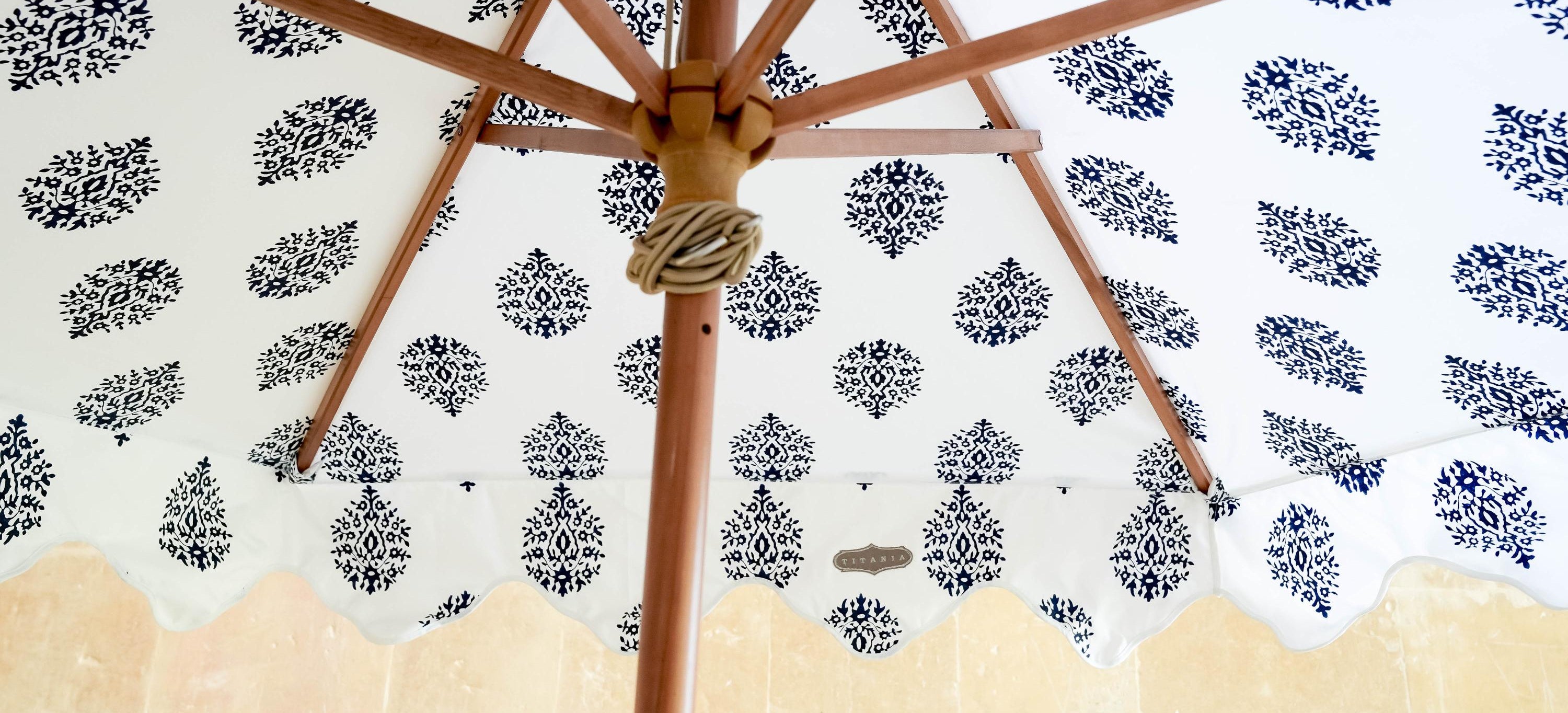 Close-up of a patterned umbrella with a decorative background