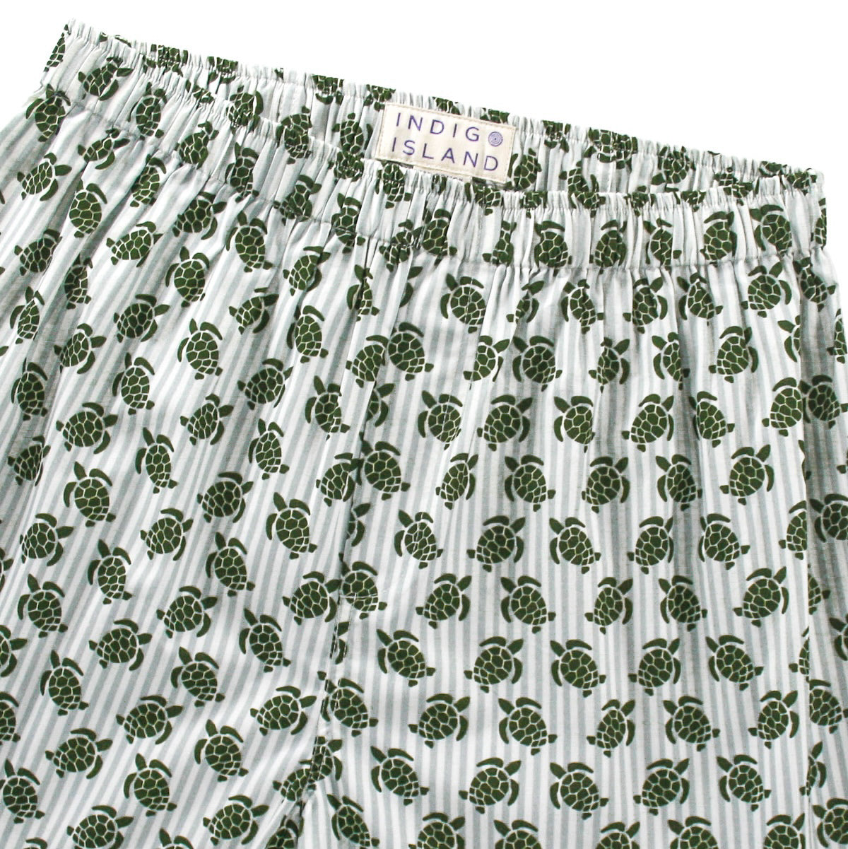 Green turtle patterned shorts with 'Indigo Island'